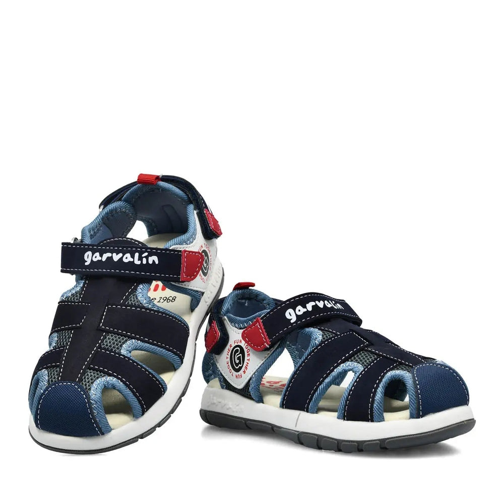 Garvalin Children Sandals Navy Blue; navy sandals with red accents and adjustable Velcro straps fastened for a secure fit.