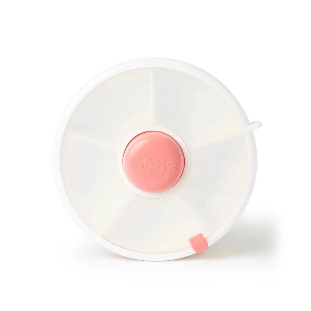 Gobe Snack Spinner Small white lunch accessory; pink center cap and pull-tab visible on a flat surface.