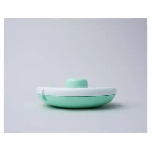 Gobe Snack Spinner Small mint-green and white lunch box, photographed closed with lid securely snapped.