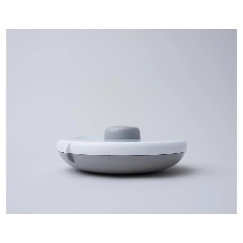 Gobe Snack Spinner Small round white lunch container with light gray lid, showcasing compact, portable design.