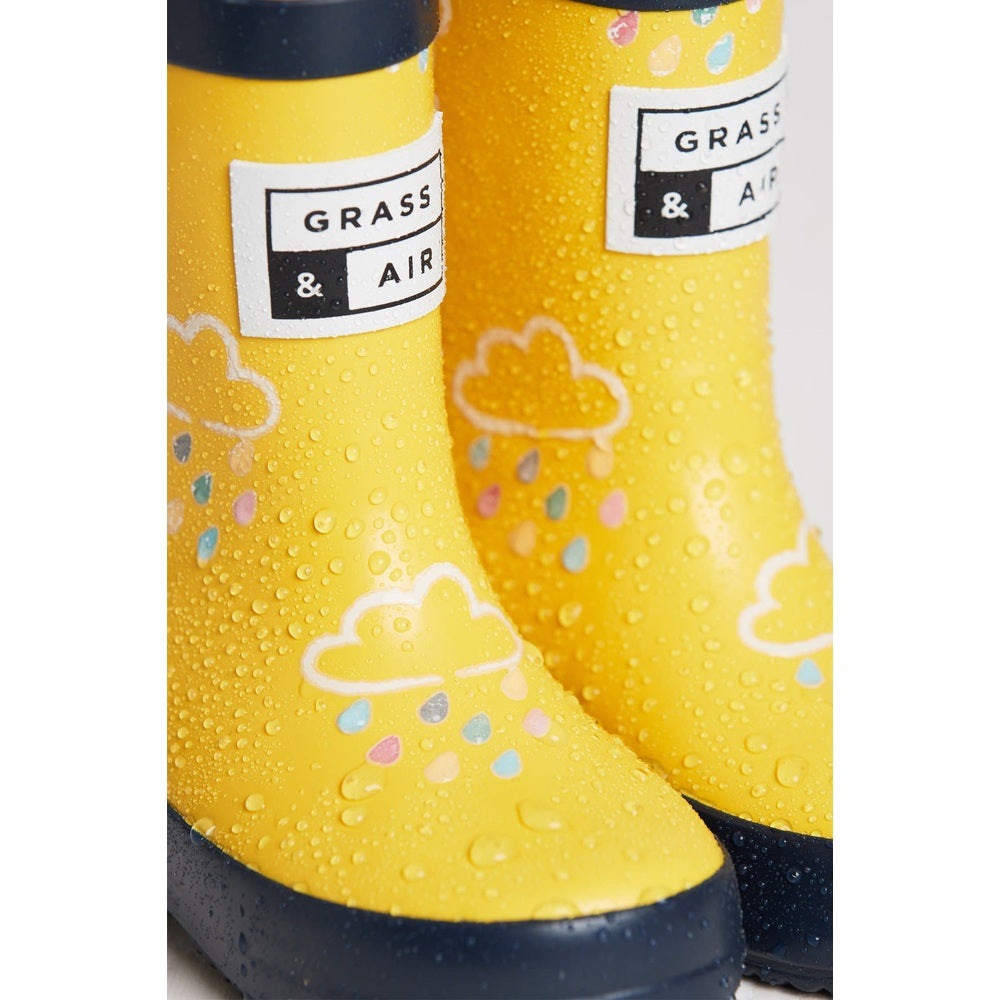 Grass & Air yellow color-revealing kids rain boots with cloud outlines and pastel confetti, 2 boots