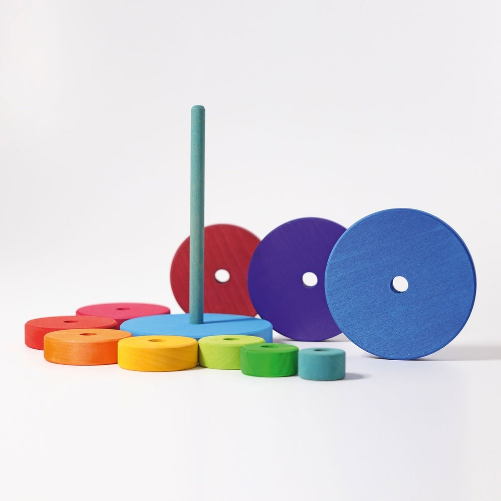 Grimm's Stacking Conical Tower Large with rainbow wooden discs and rod