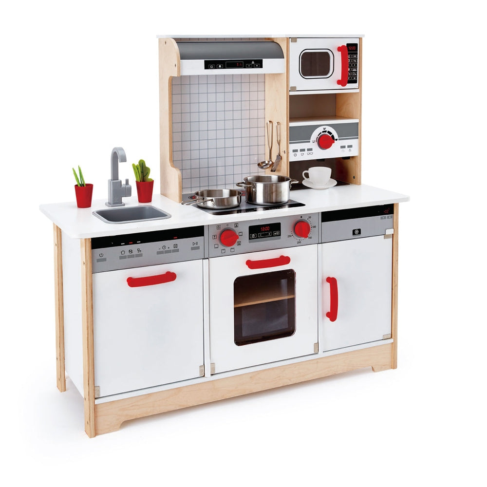 Hape All In 1 Kitchen playset, a wooden kids' kitchen with white panels, red handles, stove, sink, oven, microwave.