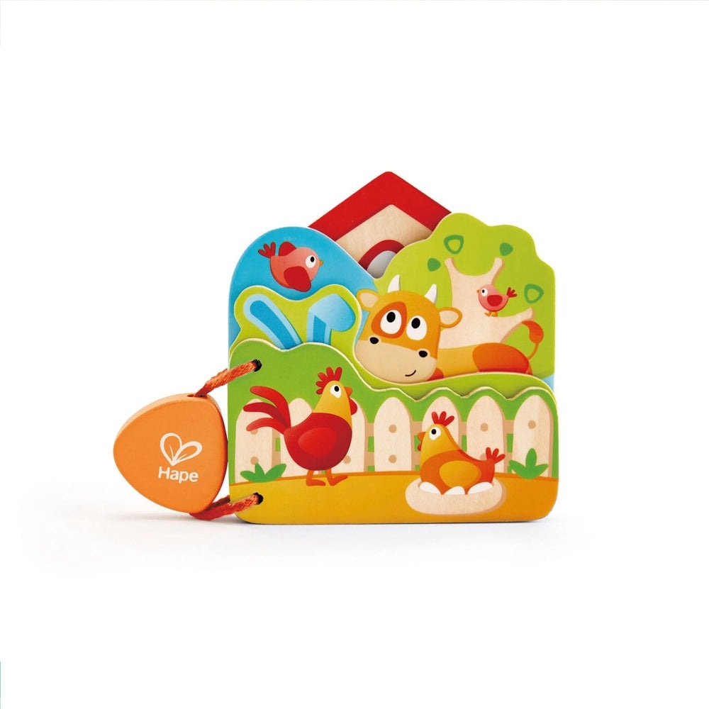 Hape Baby's Farm Animal Book colorful wooden farm scene with animals, orange tag attached by string.