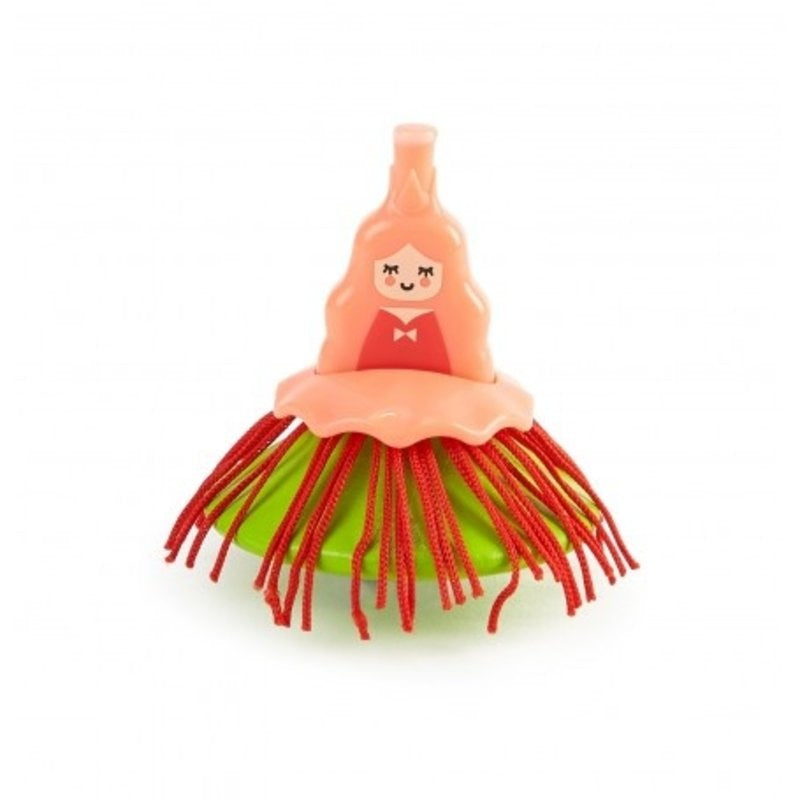 Hape Ballerina Spinning Top with pink dress and red tassels on a green base
