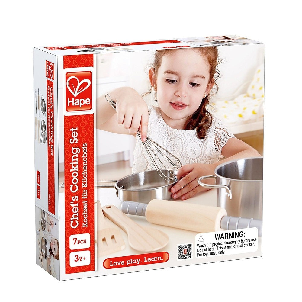 Hape Chef's Cooking Set: girl whisking a pot with metal pots and wooden utensils; 7 pcs for ages 3+ in red box