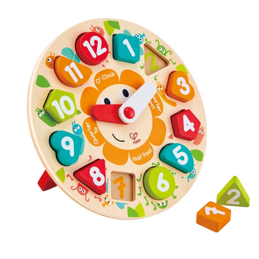 Hape Chunky Clock Puzzle, wooden clock with bright numbered blocks; two blocks sit beside the clock ready to be placed