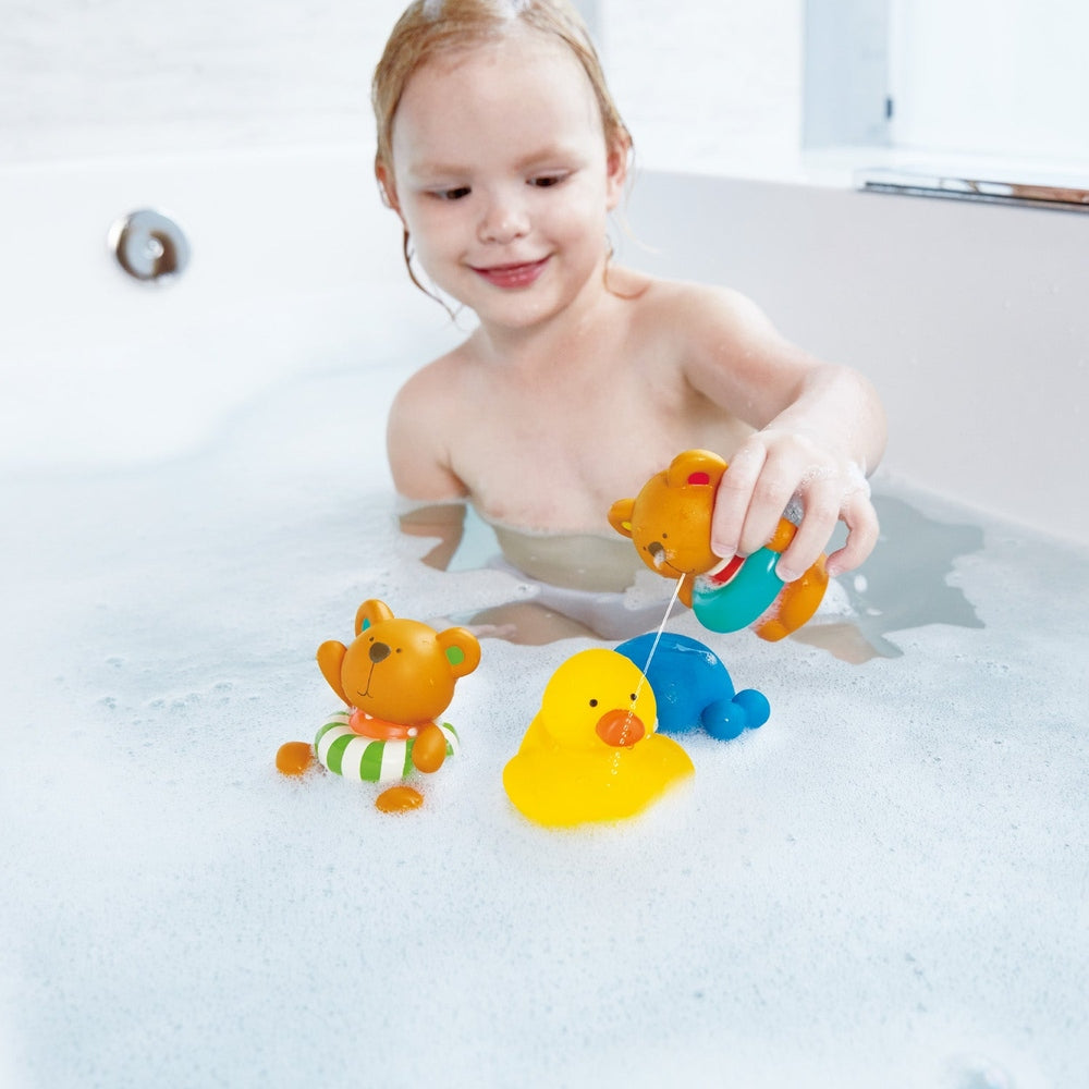 Hape Pallina Ocean Rescue bath toys; bright bears, duck and rings float as child pulls a toy with string.