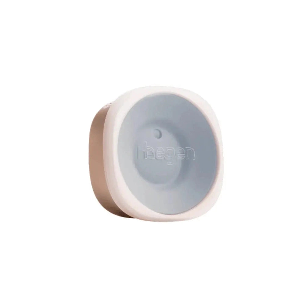HEGEN PCTO All-Rounder Crown 12M+ silicone feeding lid in white/gray, ready for baby's transition.