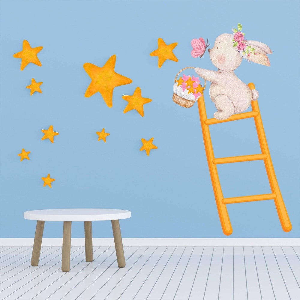 Hello Beautiful Designs bunny climbing orange ladder wall sticker, collecting orange stars and a pink butterfly.