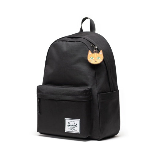Herschel Cat Bag Charm in Orange Cat, shown attached to a black backpack.