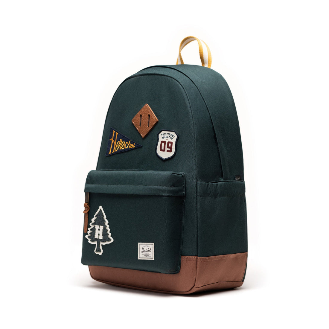 Herschel Heritage Backpack in Patches Green Gables, three-quarter front view.