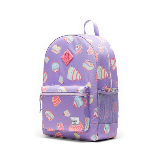 Herschel Heritage Youth Backpack in Cakes, three-quarter side view.