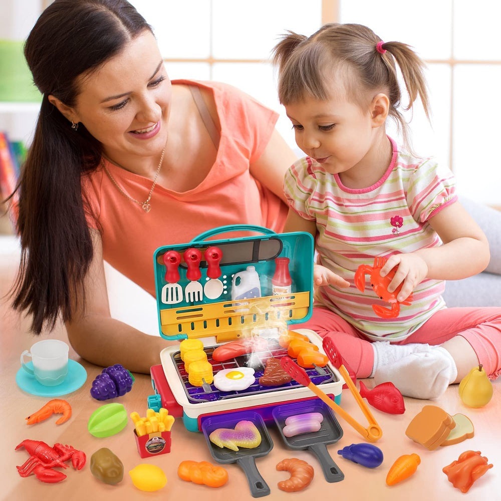 Holy Fun Kids Grill Playset in turquoise case with red utensils and assorted toy foods