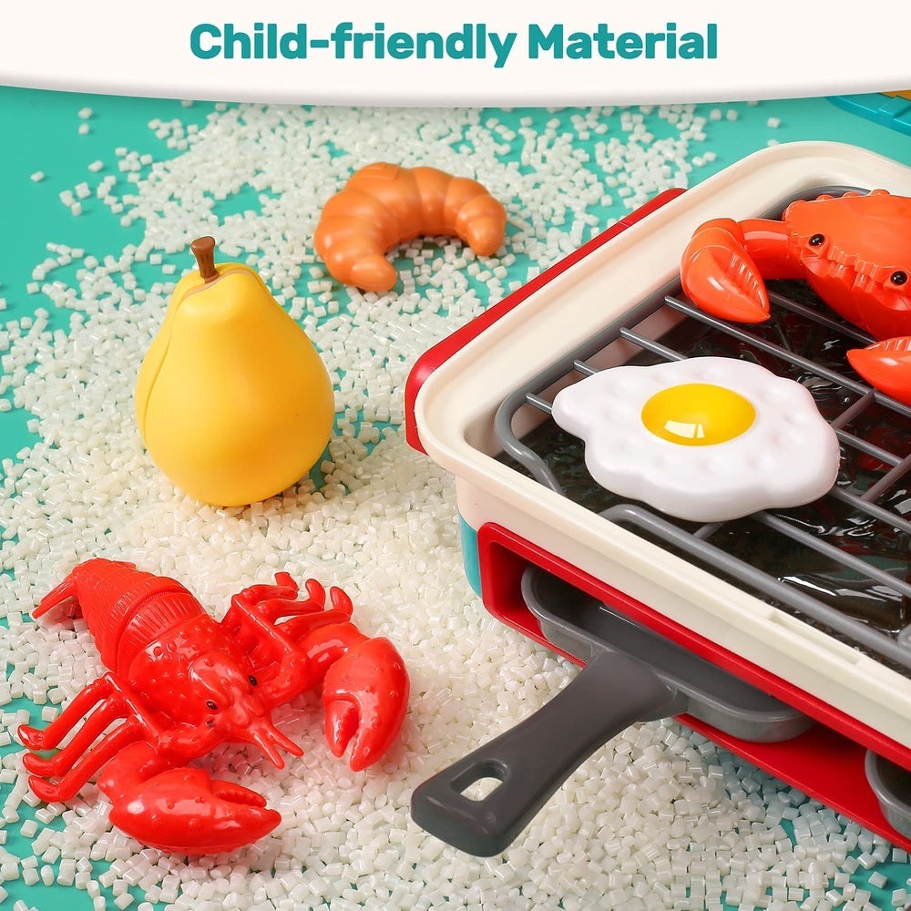 Holy Fun Kids Grill Playset; sunny-side-up egg on grill with red lobster pieces