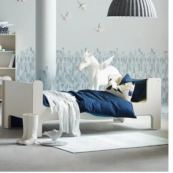 ILOOM Cabin Bunk Bed Stair Type with Lighting in a white frame, blue bedding, unicorn decor