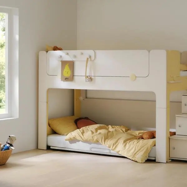Iloom Cabin Lower Bed, white bunk-style toddler bed with yellow bedding; lower bunk ready for use.
