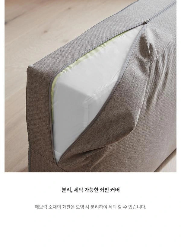 Complete photograph and caption showing removal of the grey Eddi seat cover for washing; no whole-unit washing claim.