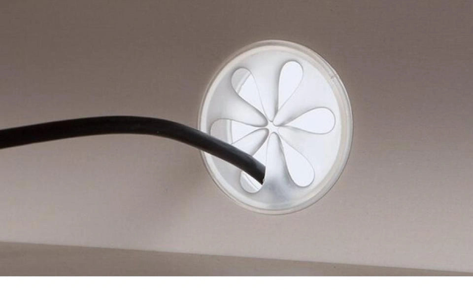 Complete rear circular cable-cap photograph with a cable passing through it.