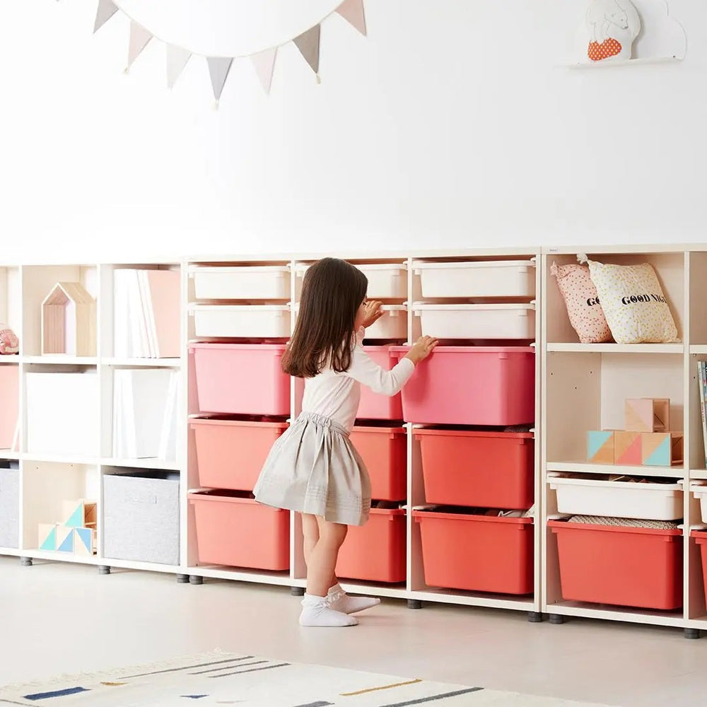 ILOOM Eddi Kids 3-Story Cabinet with pink fabric storage bins; child opens a bin in a white modular shelf.