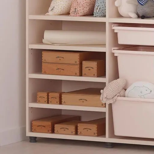 ILOOM Eddi Kids Bookshelf With Toy Storage in white, shelves neatly hold wooden boxes and toys.