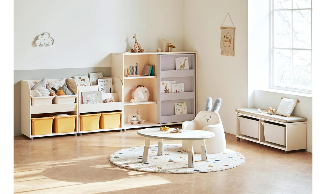 Matching-height Eddi Kids front-facing bookcase and toy storage alongside separate bookcases, bench, table and chair.