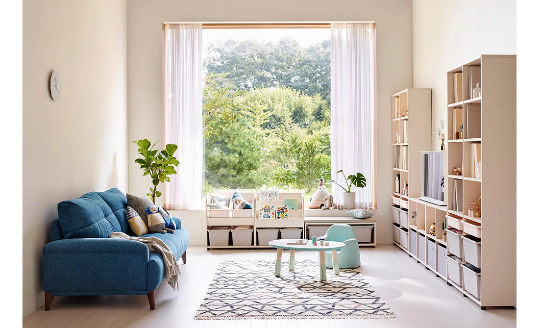 Complete Eddi Kids living-room arrangement with low bookcase and toy storage under a window; other furniture is separate.