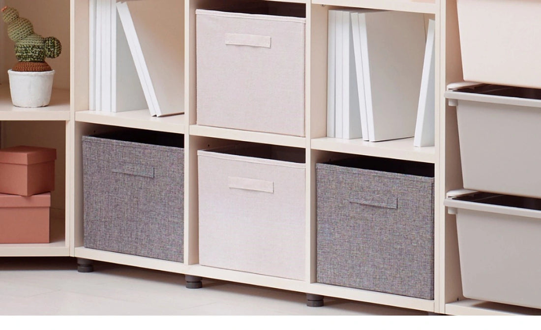 Add separate folding cloth boxes: The manufacturer illustrates optional folding cloth boxes placed within the open compartments. They are not supplied with this bookcase.