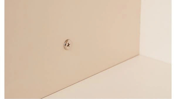 Connecting screw between adjacent ivory-toned Eddi storage units.