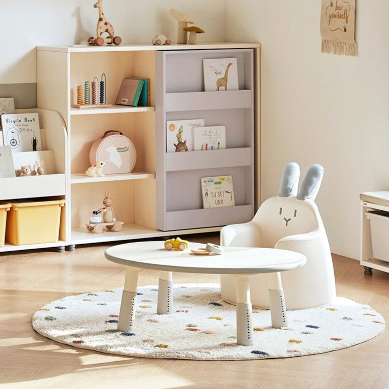 Iloom Kid's Sofa Bunny Aco Ivory in a cozy playroom with a round table and plush rug