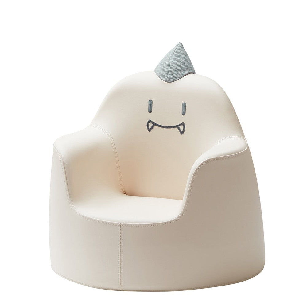 ILOOM Kid's Sofa Dino Aco Ivory, ivory faux-leather chair with a gray fin and friendly face