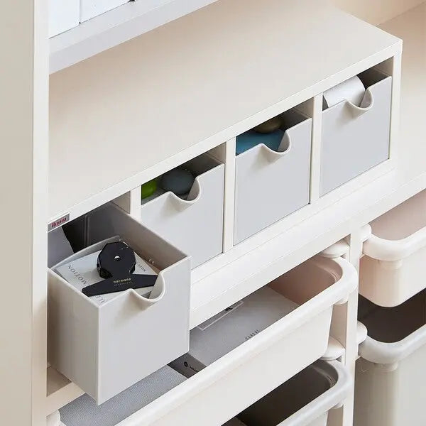 Iloom Linki Plus Accessory Box being pulled from a white shelving unit, showing front-handled, modular desk organizers.