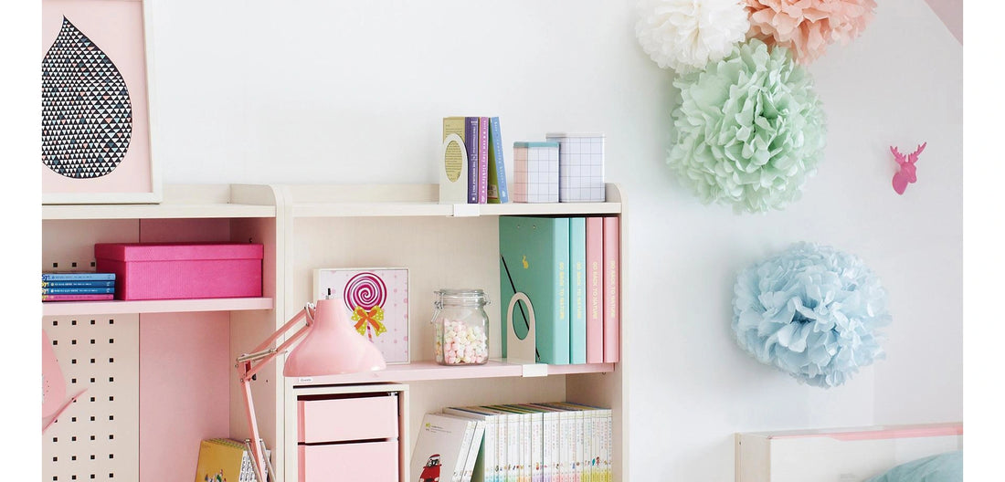 Separate favourites on a desktop shelf: Ivory bookends divide groups of books on a desktop bookcase shelf. The desk, shelf, drawer units and displayed contents are not supplied.