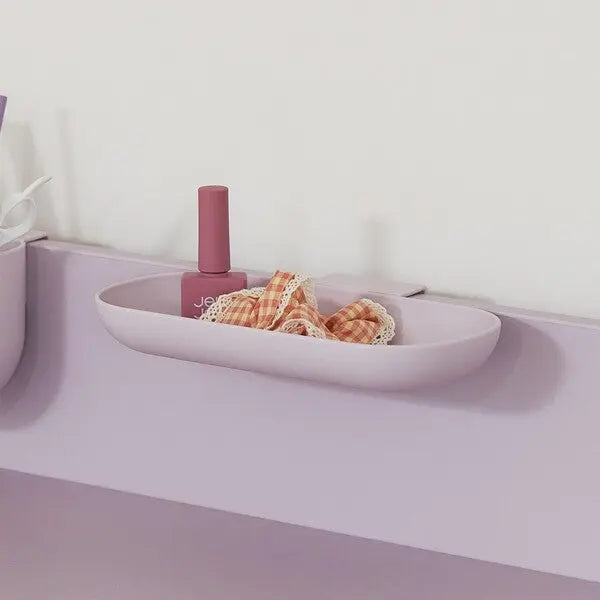 Iloom Linki Plus multipurpose shelf in lavender mounted on wall, holding a pink bottle and gingham cloth.
