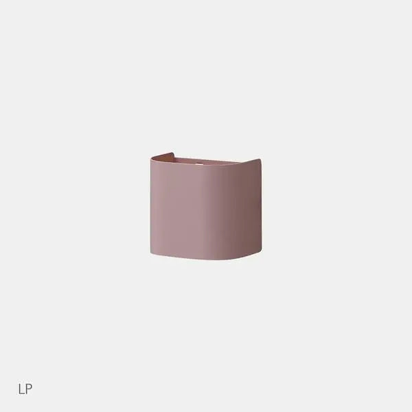 Iloom Pencil Case in dusty pink, curved leather-like design resting upright on a light background.