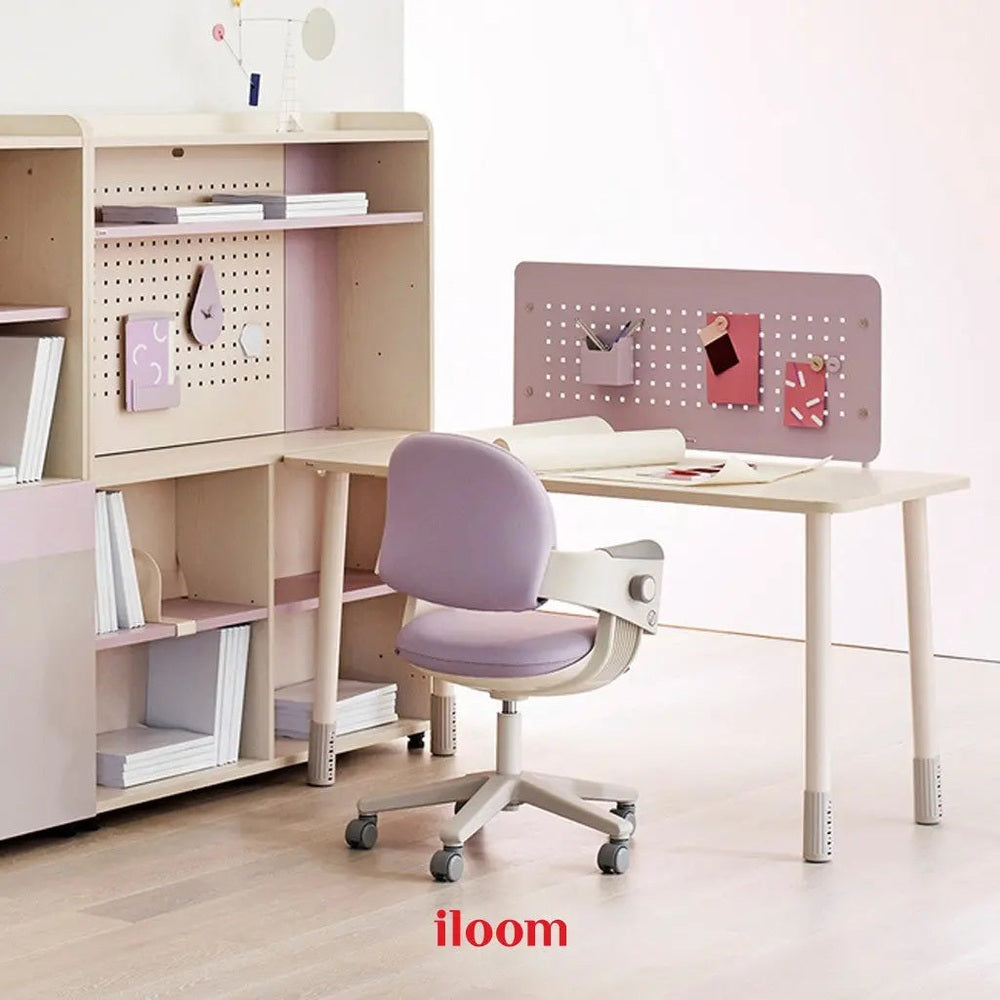 Iloom Ringo I Chair in lavender at pastel desk, showing fixed center bar, rotating casters, and footrest.