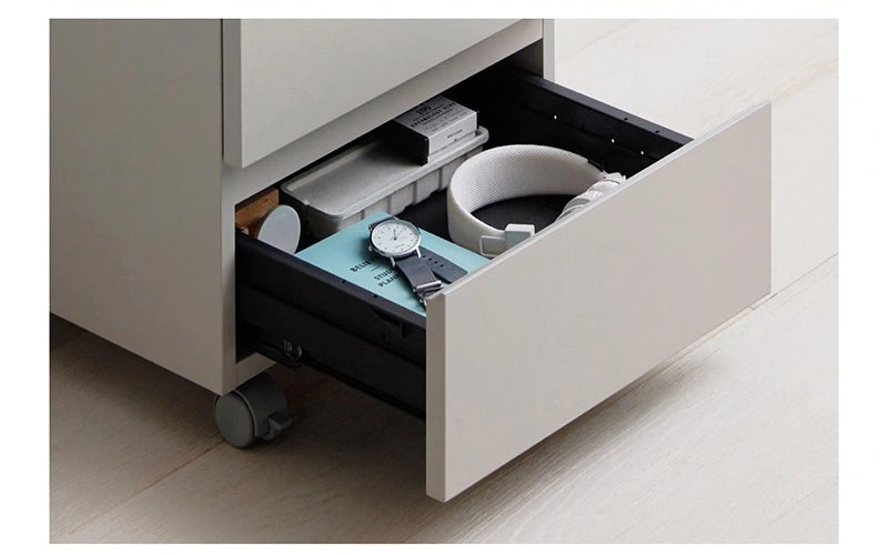Complete manufacturer open-drawer photograph with personal belongings arranged inside; displayed contents are not included.