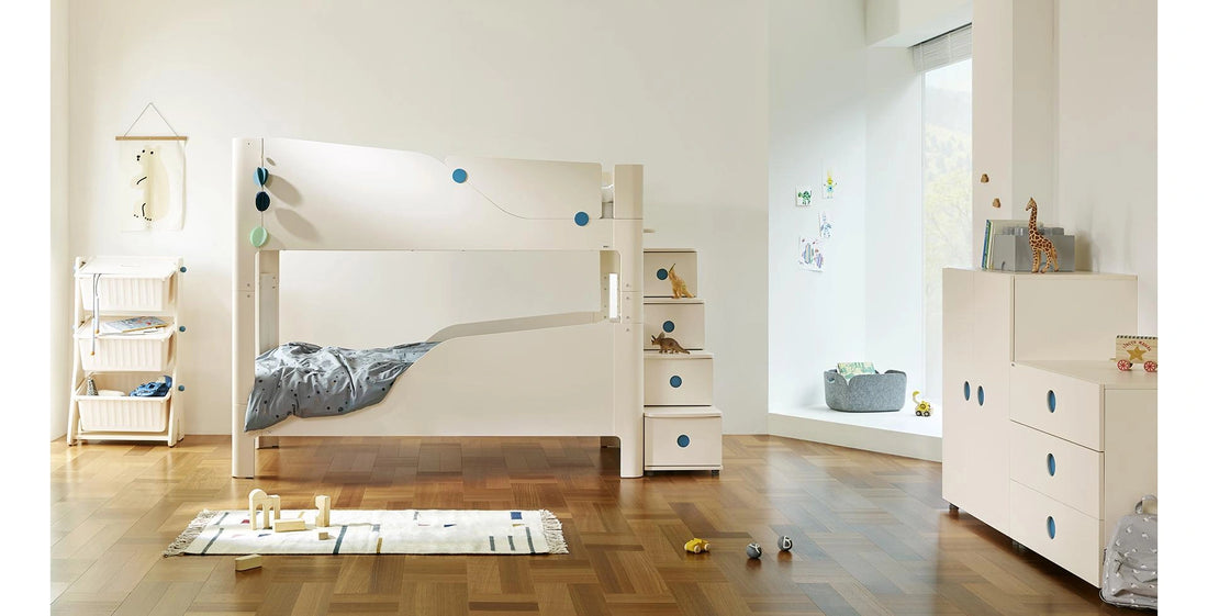 Coordinate with a bunk-bed layout: At the right of this room, the Sky three-drawer dresser stands beside a separately purchased two-door wardrobe.