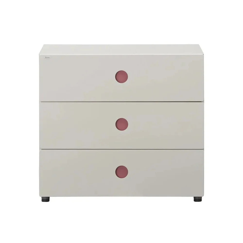 HSLC7083NA Pink option full studio view: ivory-toned three-drawer dresser with pink recessed round handles.