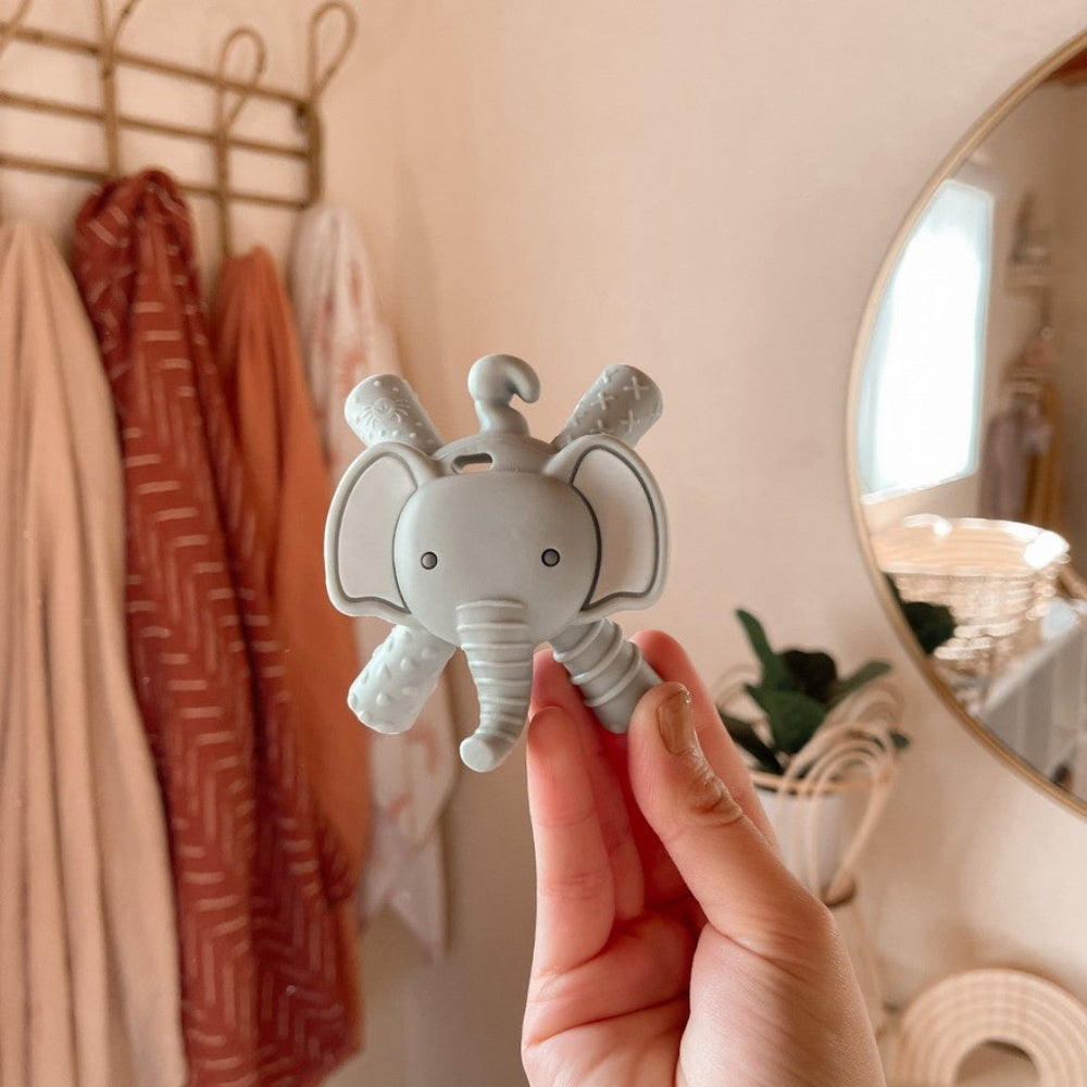Itzy Ritzy elephant molar teether in gray silicone with textured limbs and trunk