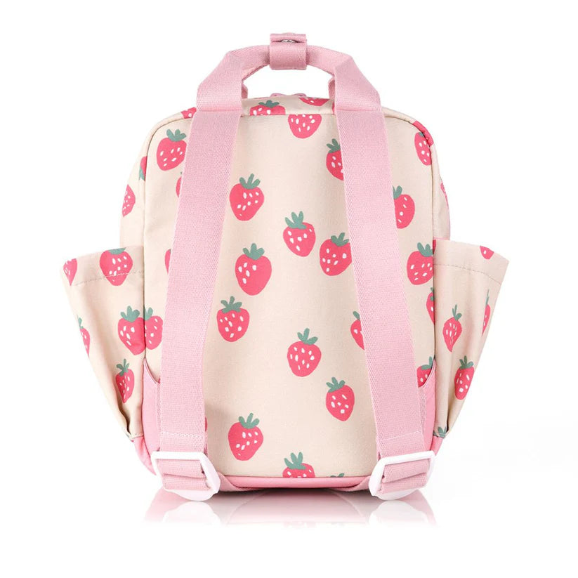 Itzy Ritzy Backpack in strawberry-print fabric with pink straps, handles and side pockets.