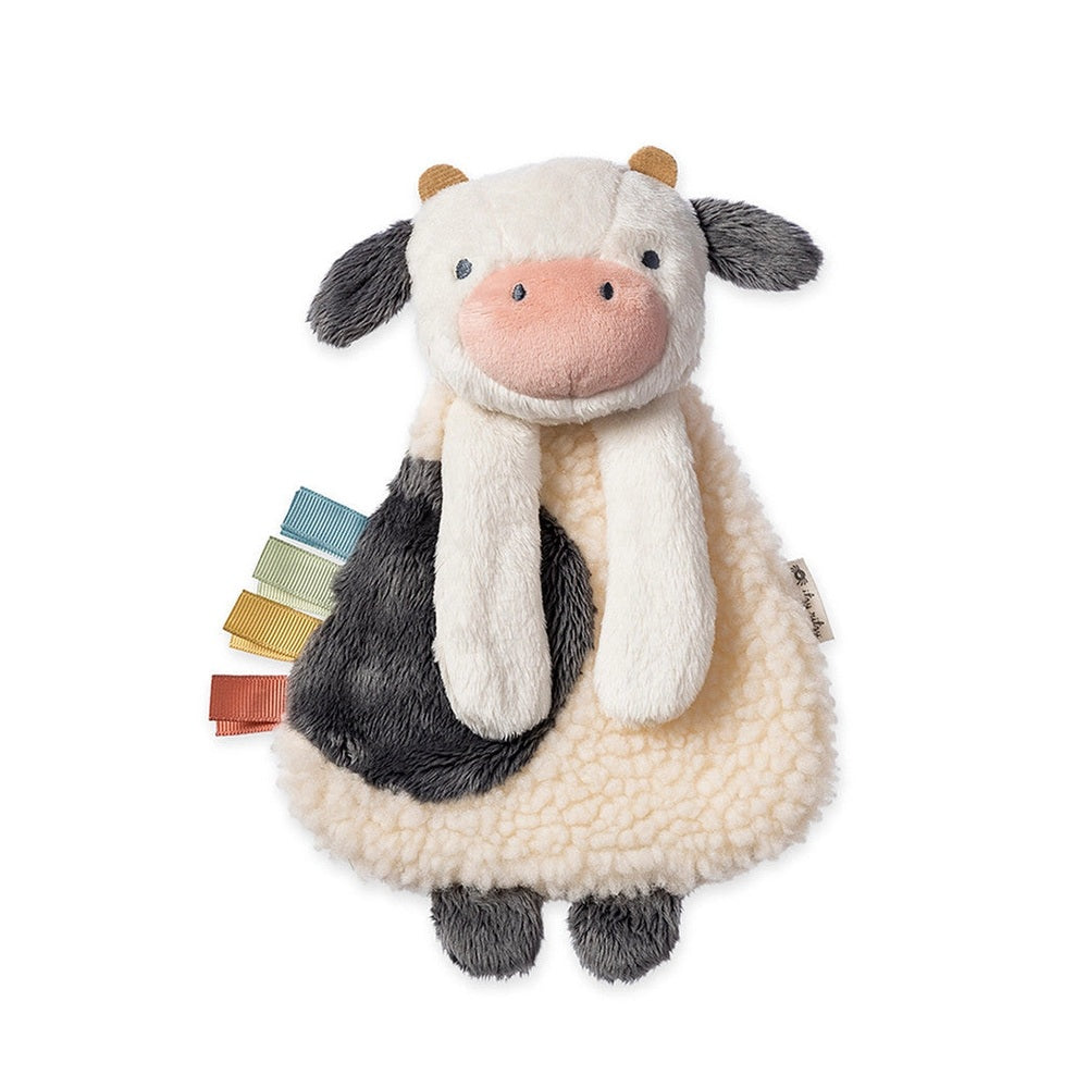 Itzy Ritzy Bitzy Busy Gift Set plush cow toy with multicolor ribbon tags