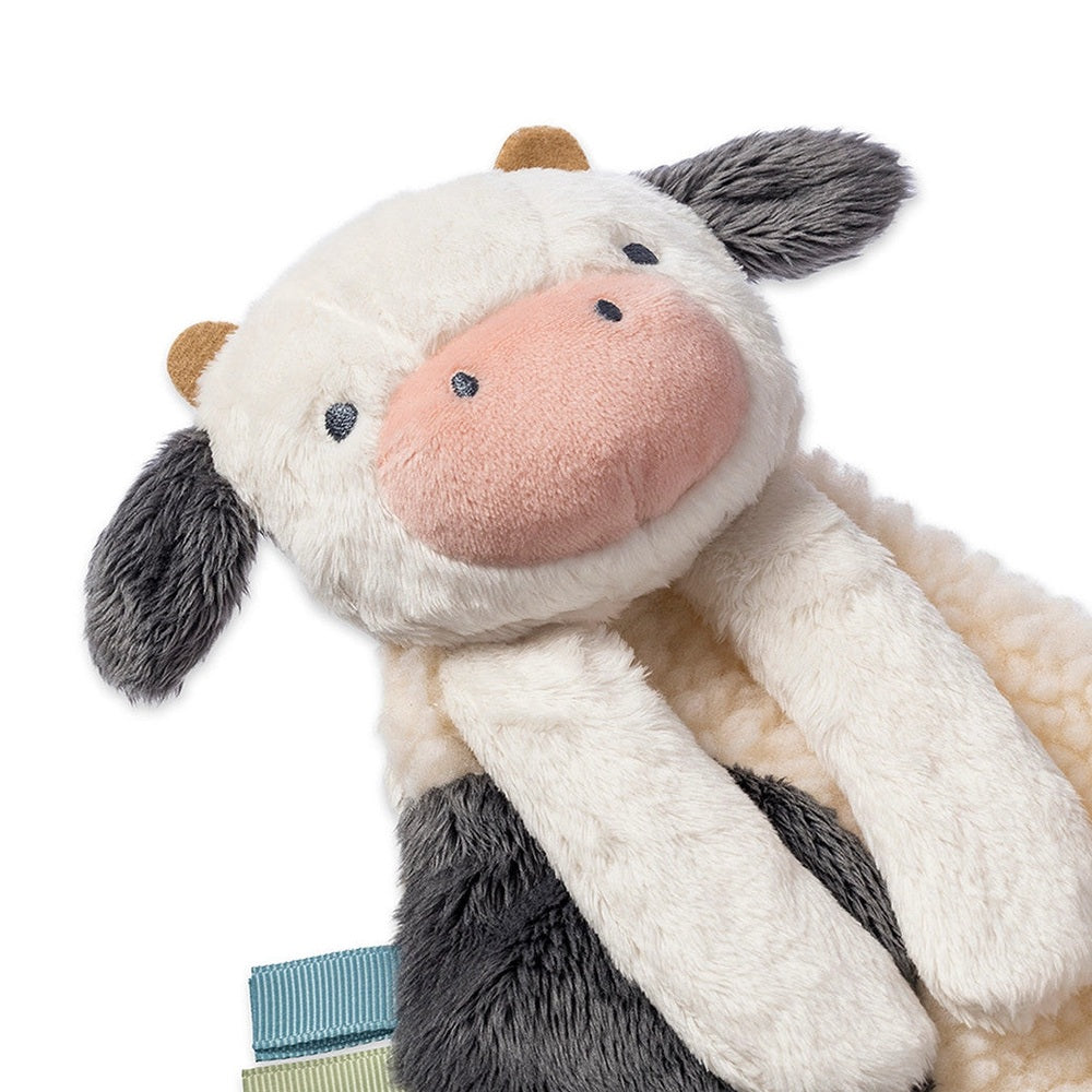 Itzy Ritzy Bitzy Busy Gift Set plush cow toy with cream fur, pink nose and grey ears