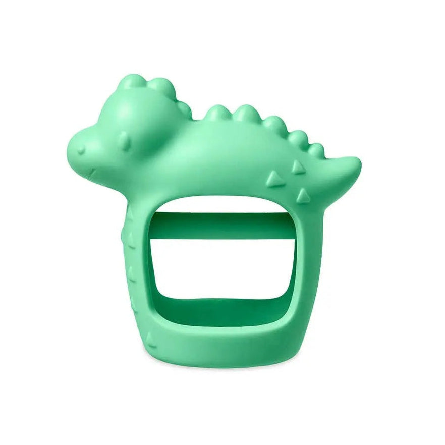 Itzy Ritzy Bitzy Grip teether, green silicone dinosaur with ring handle being chewed by baby.