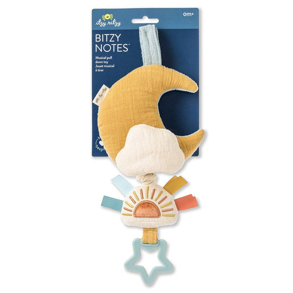 Itzy Ritzy Bitzy Notes Moon and Sun musical pull-down toy with yellow crescent moon, white cloud, sun charm, teal star teether