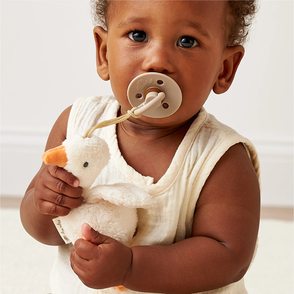 ITZY RITZY Itzy Ritzy Bitzy Pal Natural Rubber Pacifier & Stuffed Animal orthodontic pacifier set shown in image 2 of 32 with rounded shield