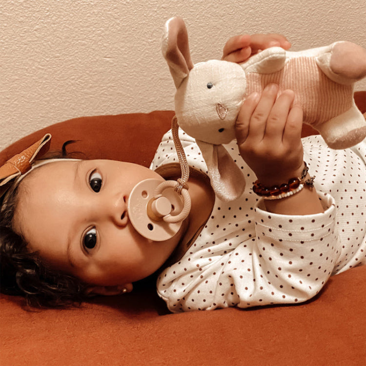ITZY RITZY Itzy Ritzy Bitzy Pal Natural Rubber Pacifier & Stuffed Animal orthodontic pacifier set shown in image 4 of 32 with rounded shield