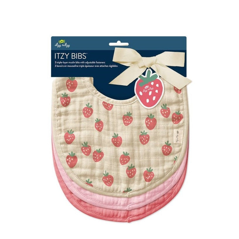 Itzy Ritzy Itzy Bibs three-layer strawberry print bibs in cream with pink and coral layers, neatly stacked.