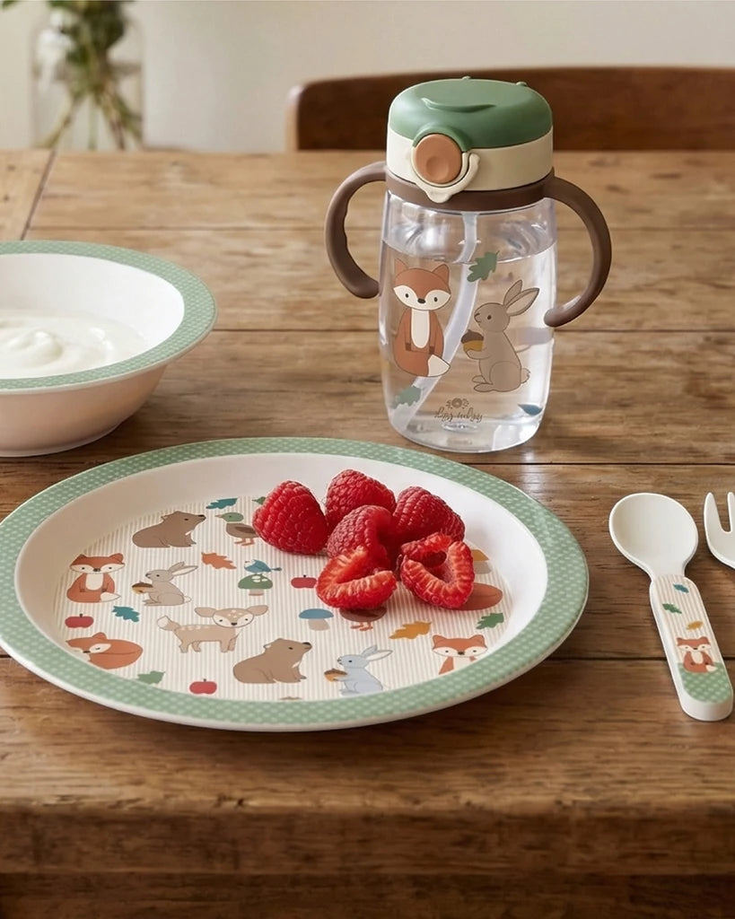 Woodland Itzy Bistro plate and spoon on a table beside an Itzy Sips cup, sold separately