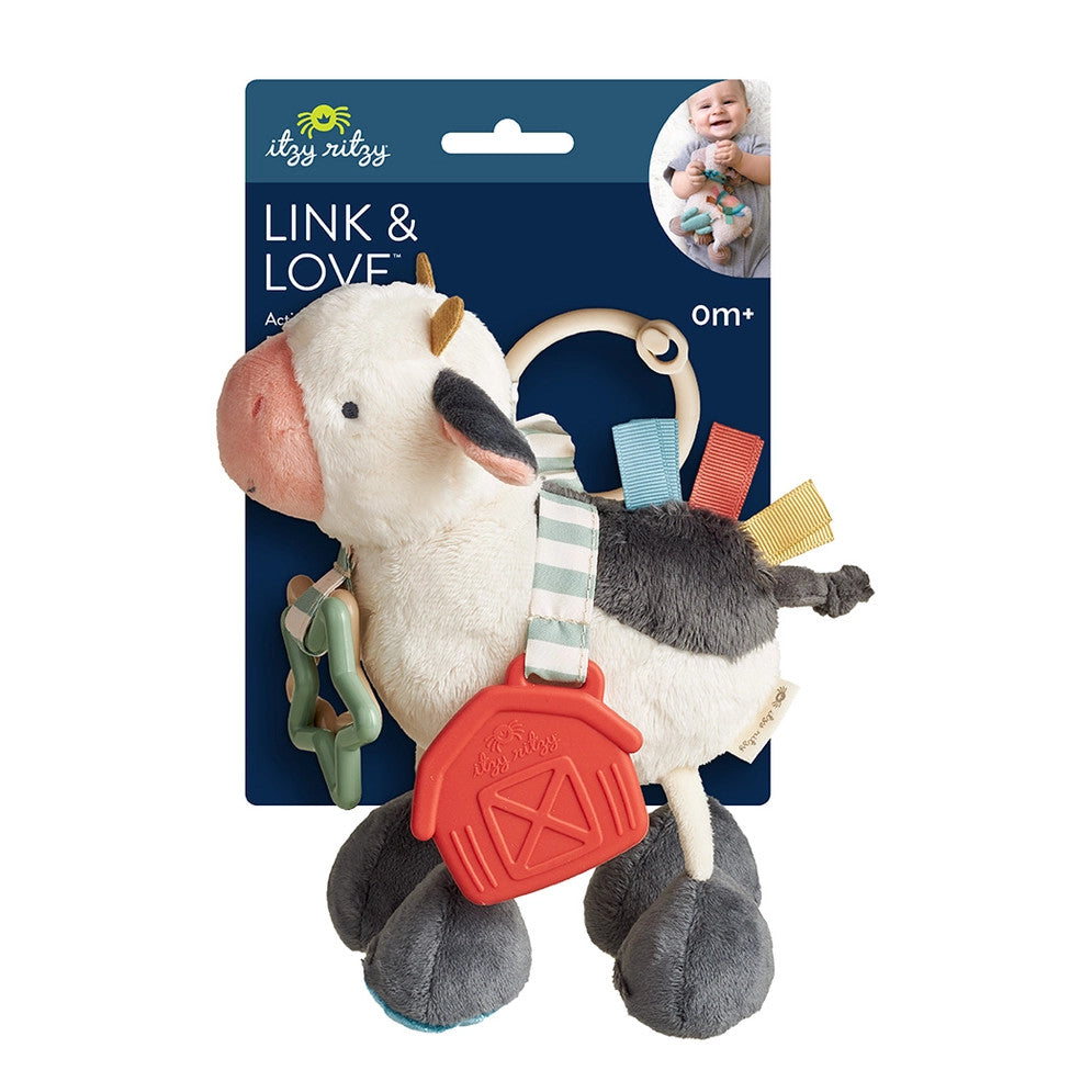 Itzy Ritzy Itzy Friends Link & Love activity plush cow with striped harness and red barn clip